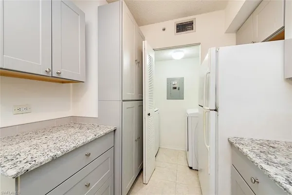 a view of a kitchen cabinets and wooden floor