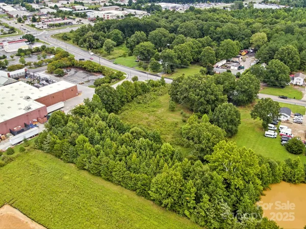 a view of a garden with a building in the background