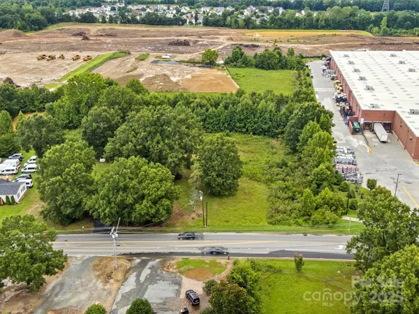 an aerial view of a yard with a lake view