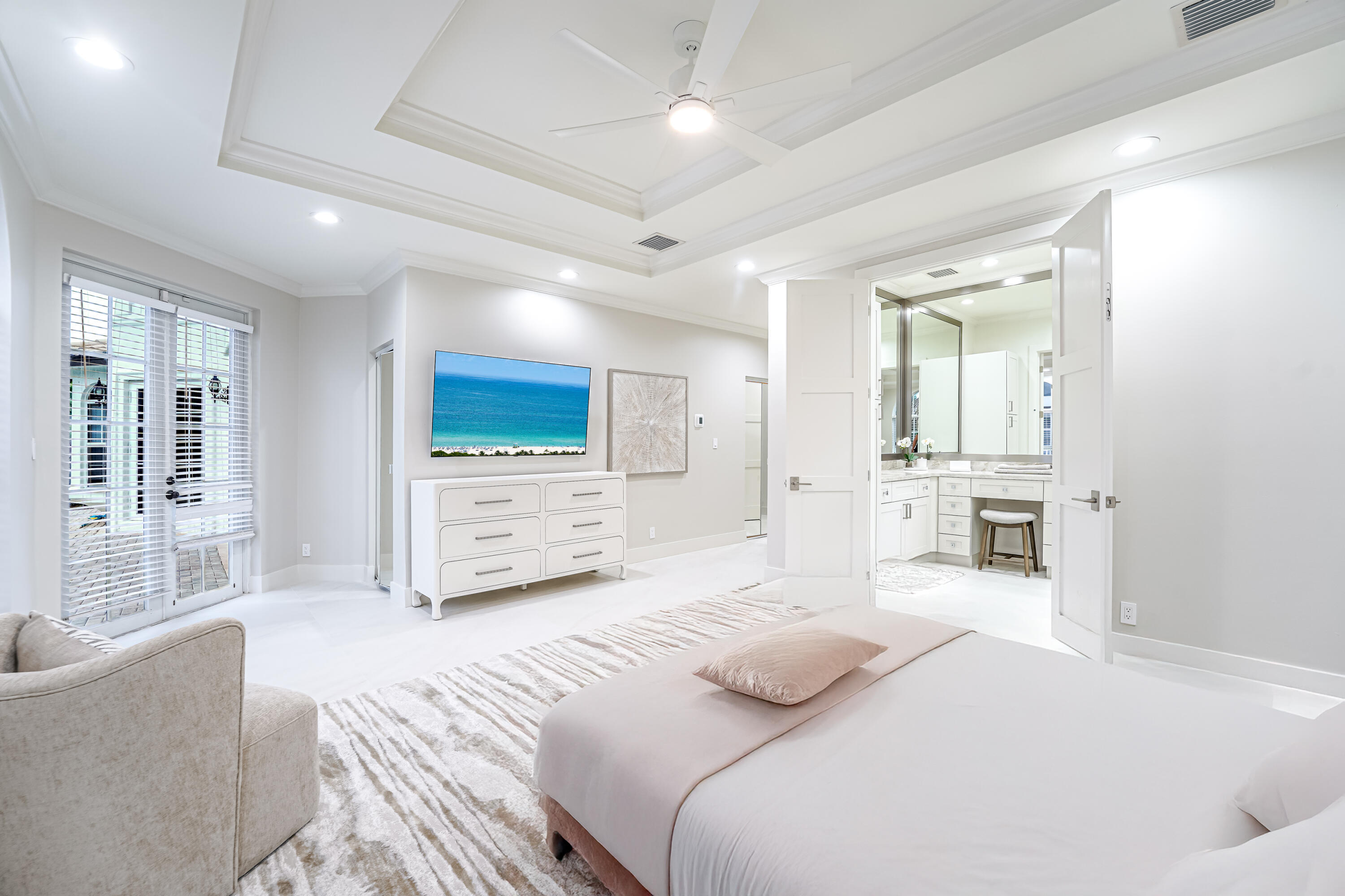 749 Northeast 71st Street Boca Raton, FL 33487 - Photo 22 of 43 a bedroom with a large bed and a couch