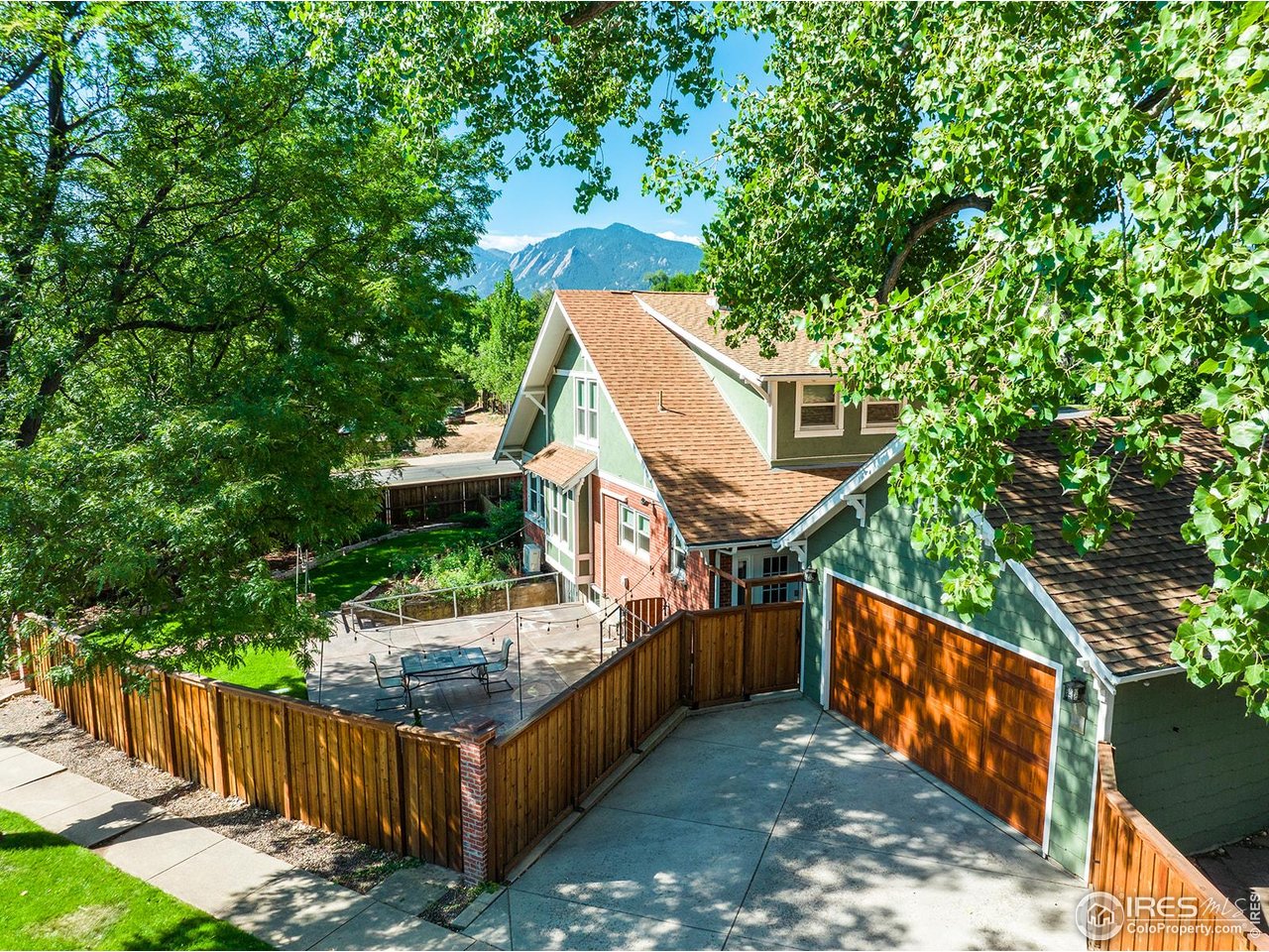 a view of a wooden fence and trees