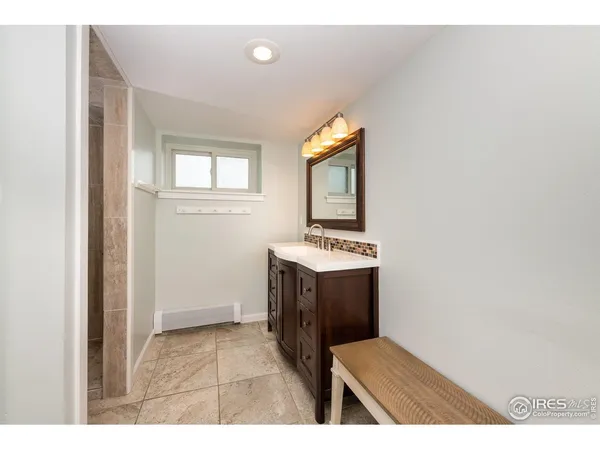 a kitchen with sink and cabinets