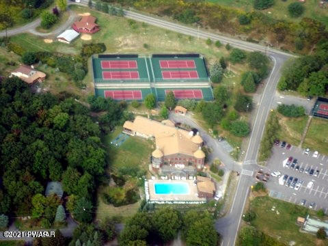 124 Rodeo Drive Hawley, PA 18428 - Photo 28 of 50 Clubhouse and tennis courts aerial view