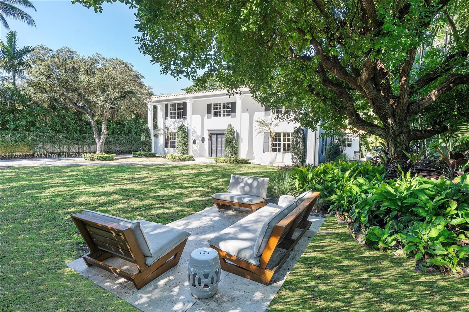 607 Melaleuca Lane Miami, FL 33137 - Photo 1 of 30 a view of a house with backyard and sitting area