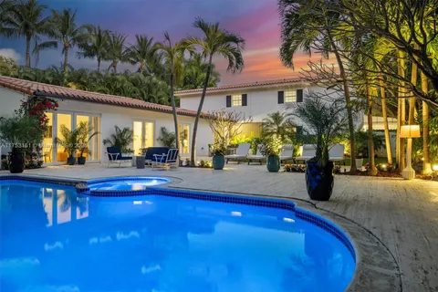 a view of swimming pool with outdoor seating and a patio