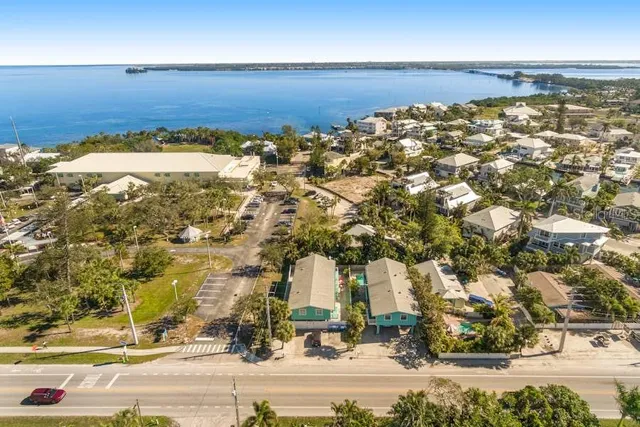 an aerial view of a house with a ocean view