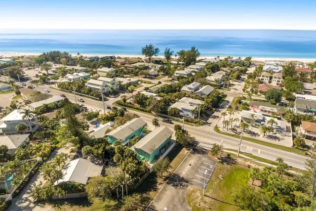 an aerial view of residential building and trees