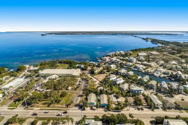 an aerial view of residential building and ocean