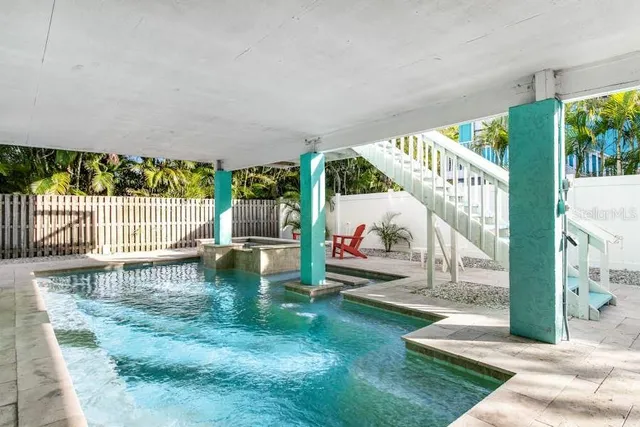 a view of house with backyard and patio