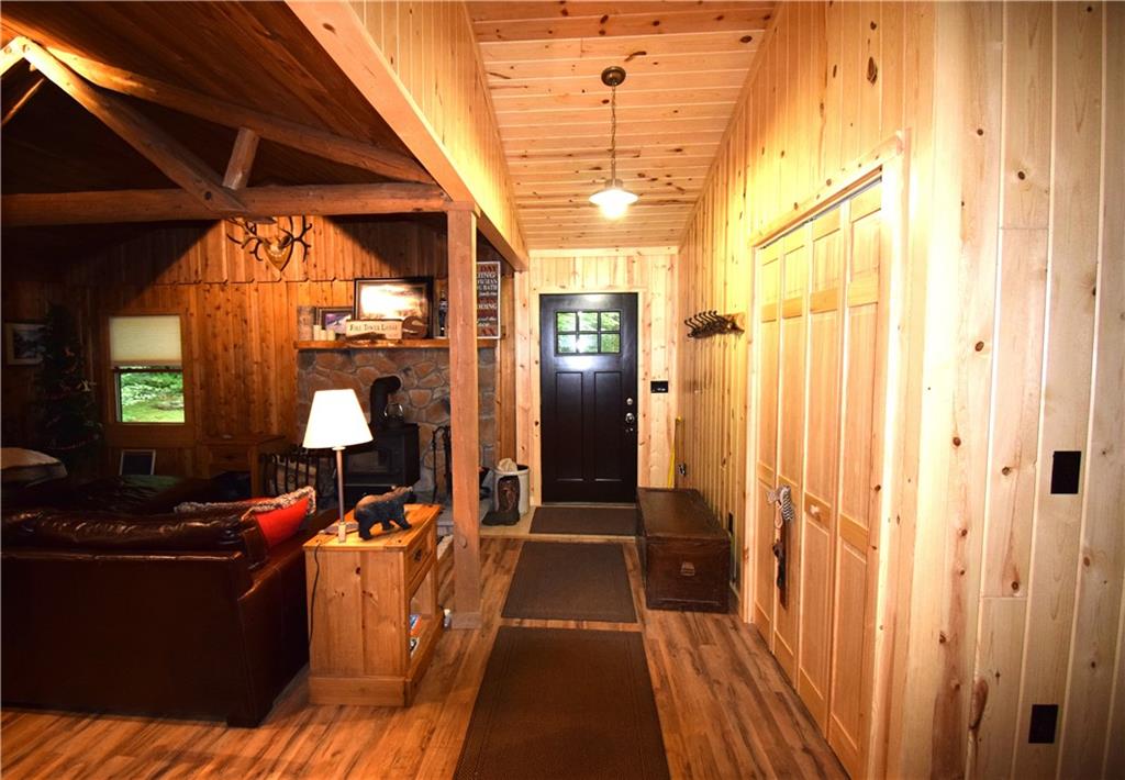189 Fire Tower Road Champion, PA 15622 - Photo 11 of 25 a room with wooden floor and furniture