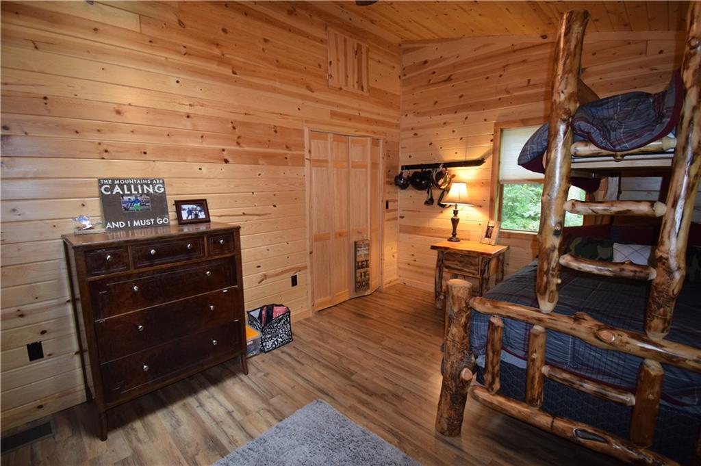 189 Fire Tower Road Champion, PA 15622 - Photo 23 of 25 a room with wooden cabinets and furniture