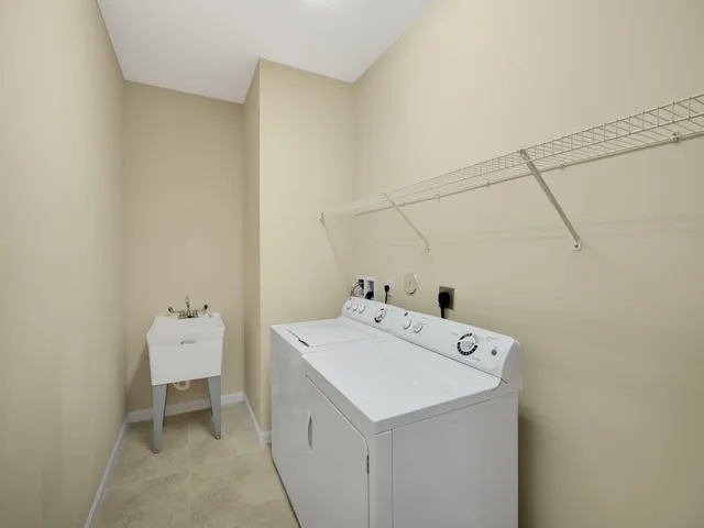 a view of a lake with houses in the back