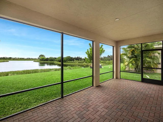 a view of a lake with houses in the back