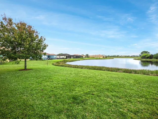a view of outdoor space with playground and green space