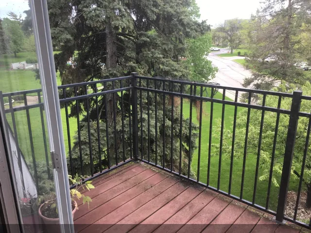 a view of a golf course with a tree