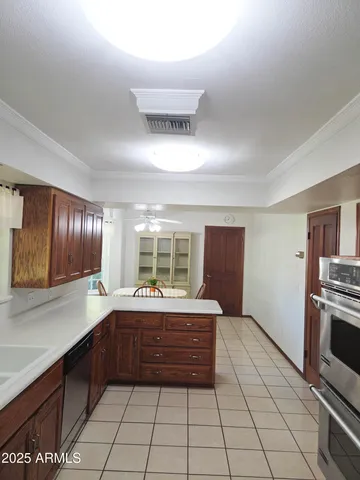 a utility room with cabinets washer and dryer