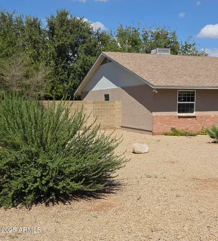 an aerial view of multiple houses with yard
