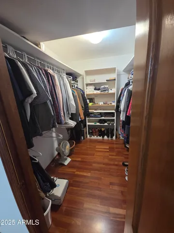 a bathroom with a granite countertop sink mirror vanity and toilet