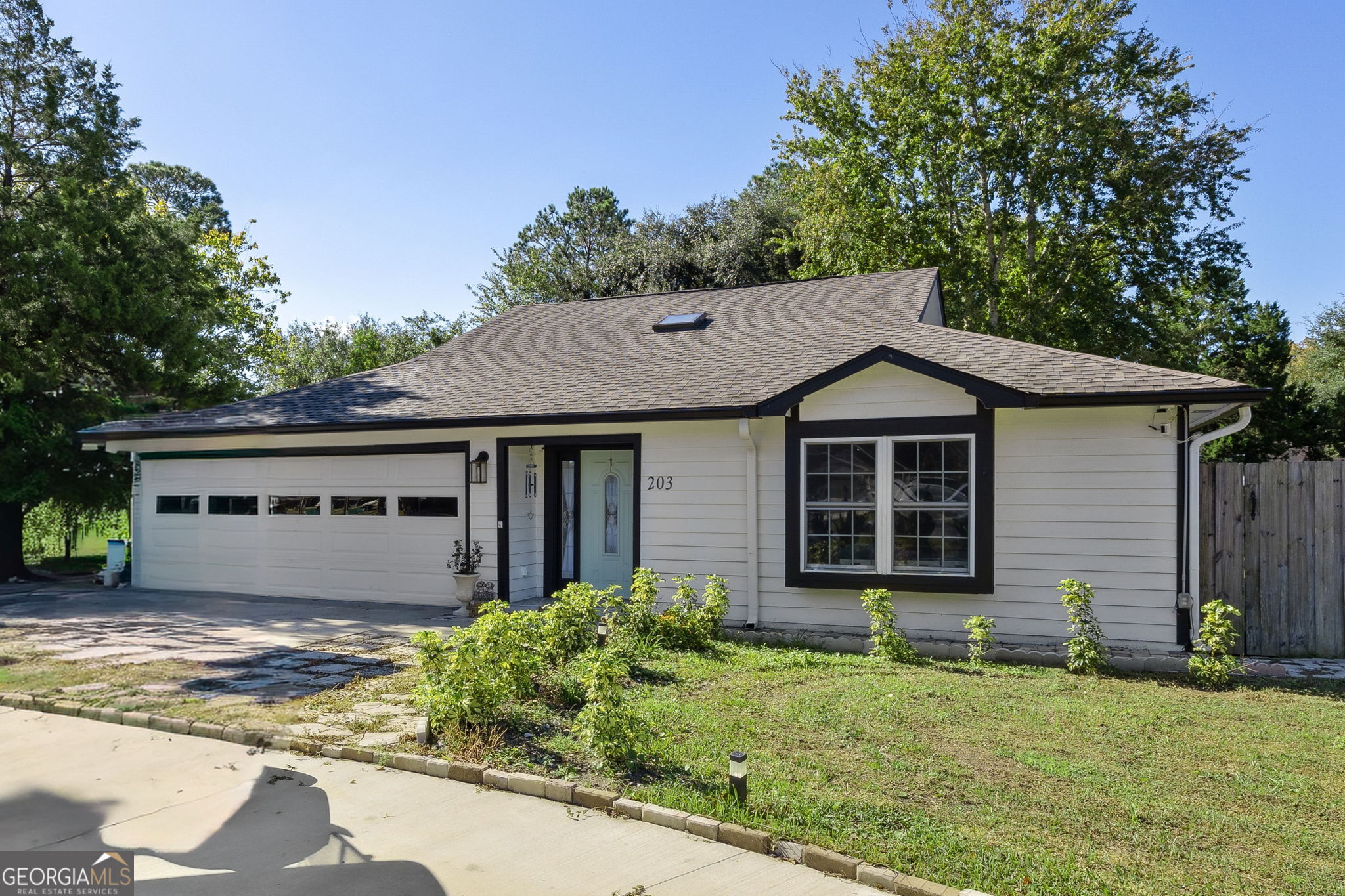 203 Foxwood Circle St. Marys, GA 31558 - Photo 1 of 52 a view of a house with a yard plants and a tree