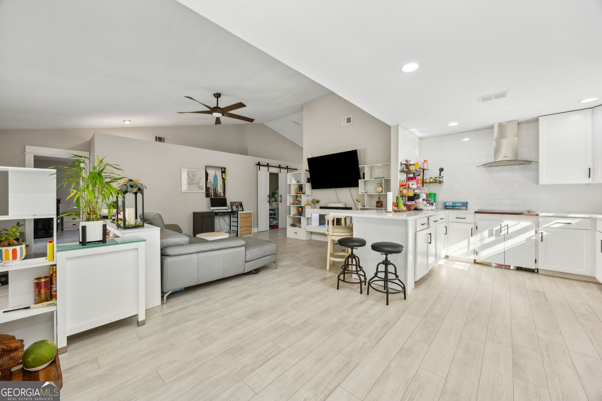 203 Foxwood Circle St. Marys, GA 31558 - Photo 12 of 52 a living room with furniture and a flat screen tv