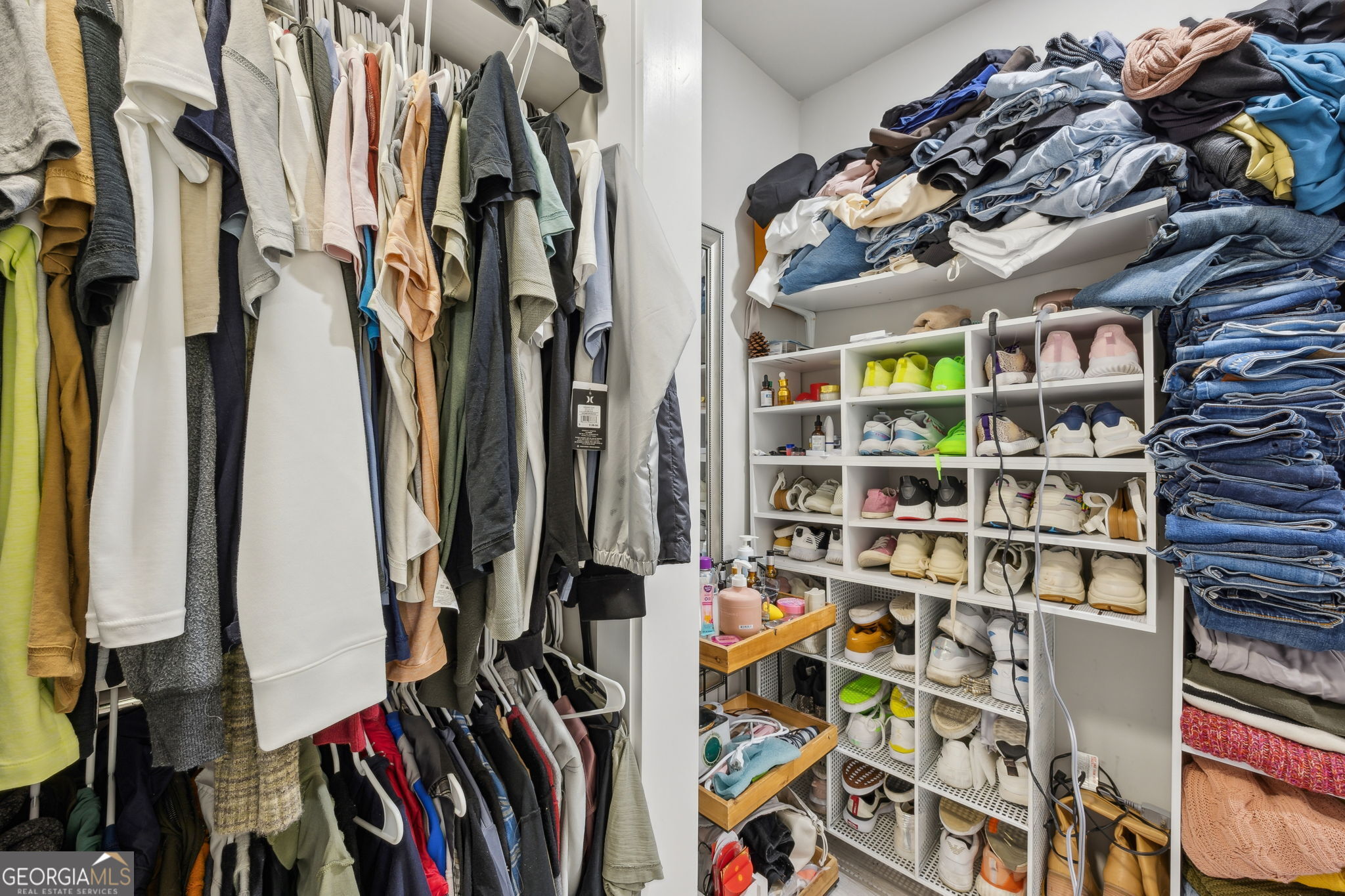 203 Foxwood Circle St. Marys, GA 31558 - Photo 19 of 52 a view of walk in closet with clothes and shoes
