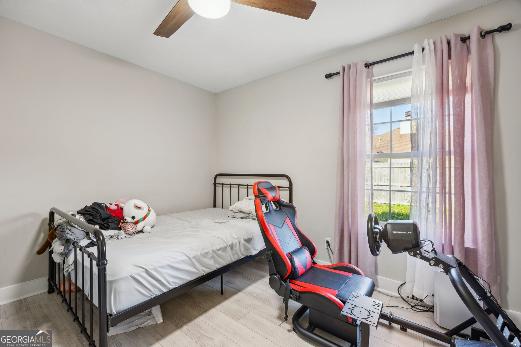 203 Foxwood Circle St. Marys, GA 31558 - Photo 22 of 52 a bedroom with furniture and a window