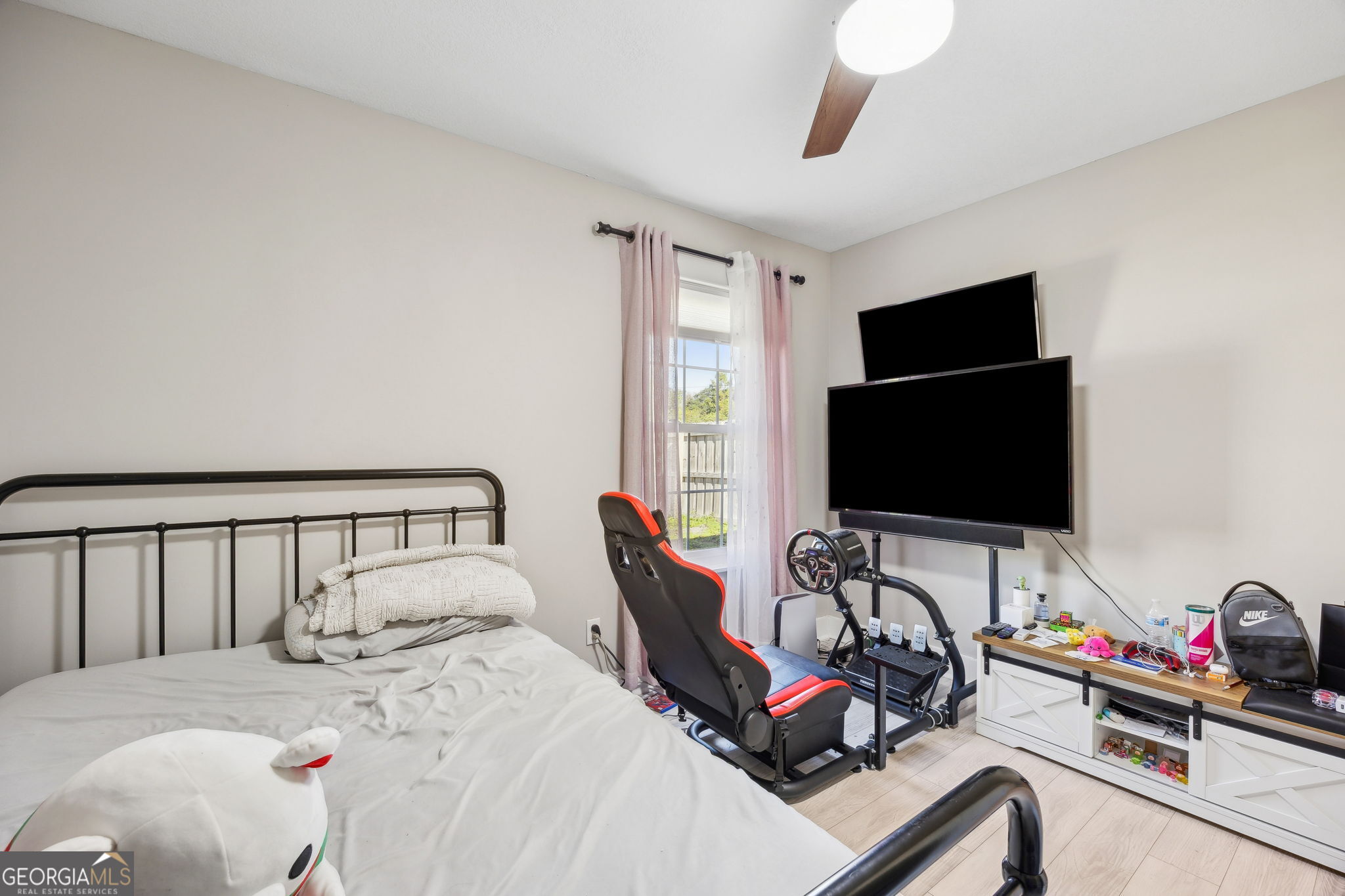 203 Foxwood Circle St. Marys, GA 31558 - Photo 23 of 52 a bedroom with bed and a flat screen tv