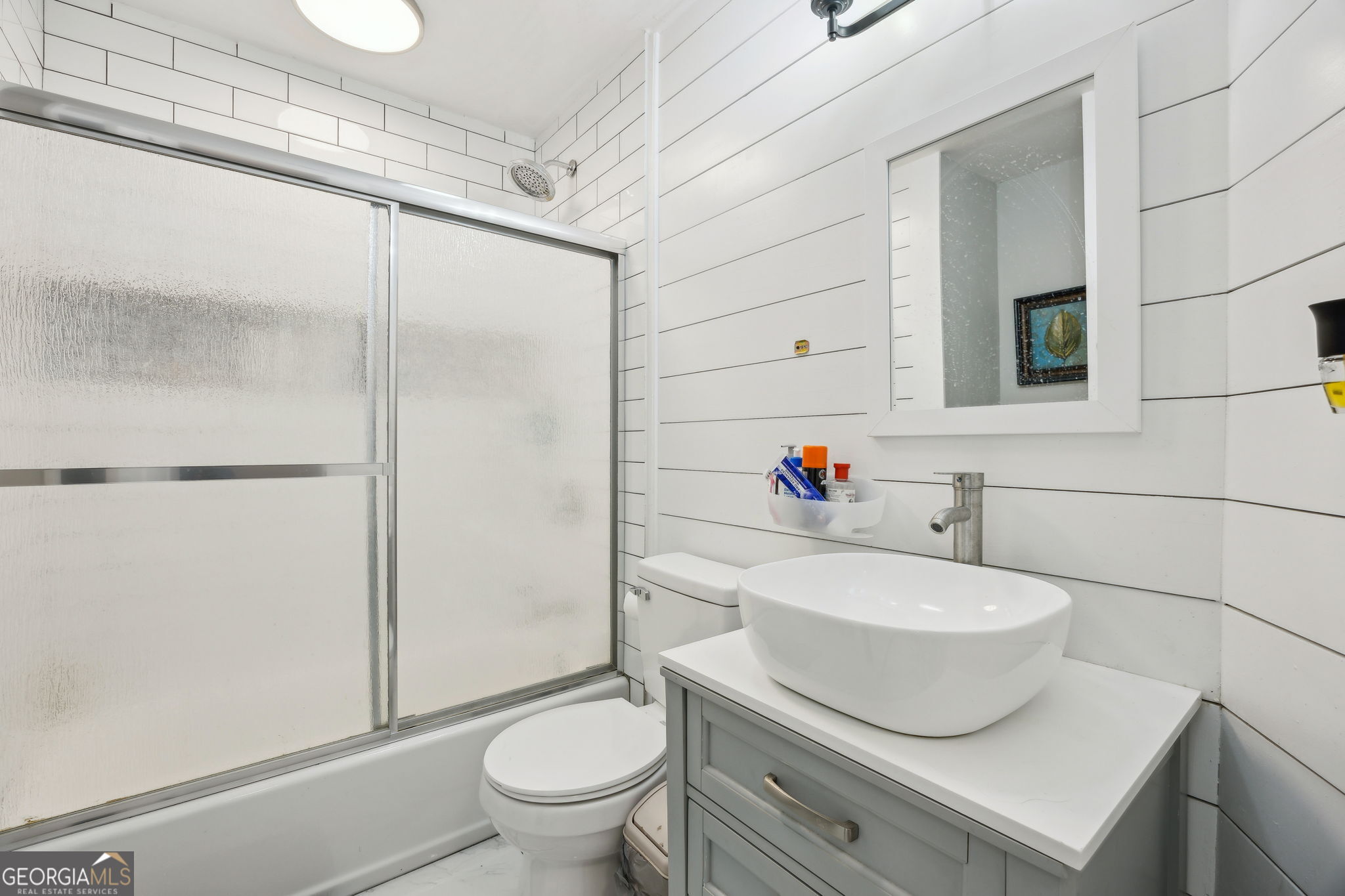 203 Foxwood Circle St. Marys, GA 31558 - Photo 24 of 52 a bathroom with a sink toilet and shower