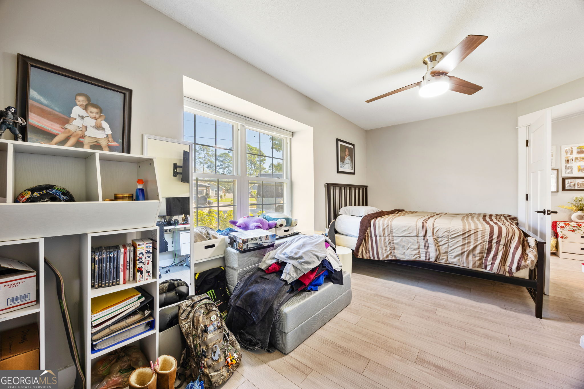 203 Foxwood Circle St. Marys, GA 31558 - Photo 27 of 52 a bedroom with furniture and a large window
