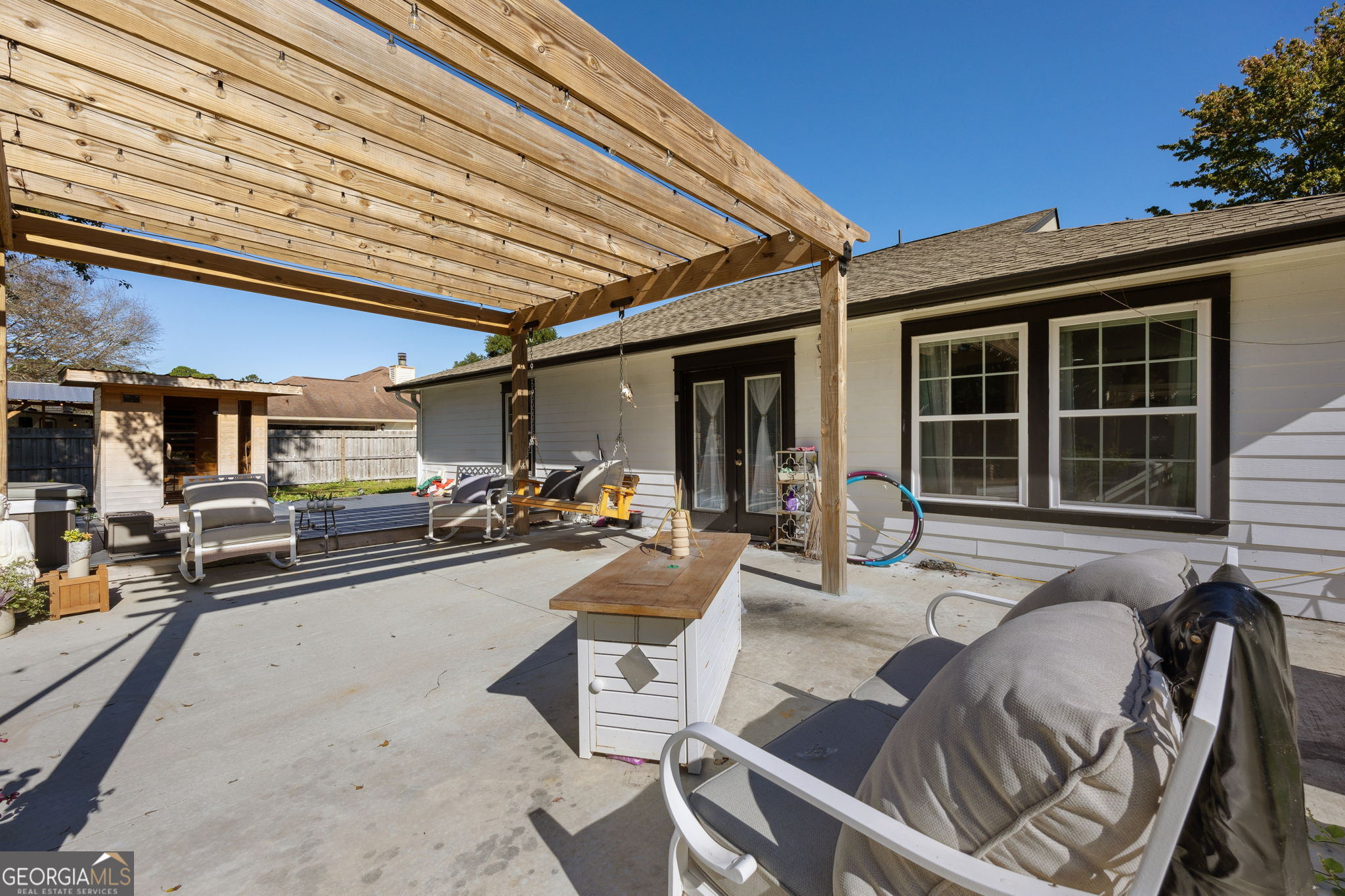 203 Foxwood Circle St. Marys, GA 31558 - Photo 29 of 52 a view of a patio with table and chairs