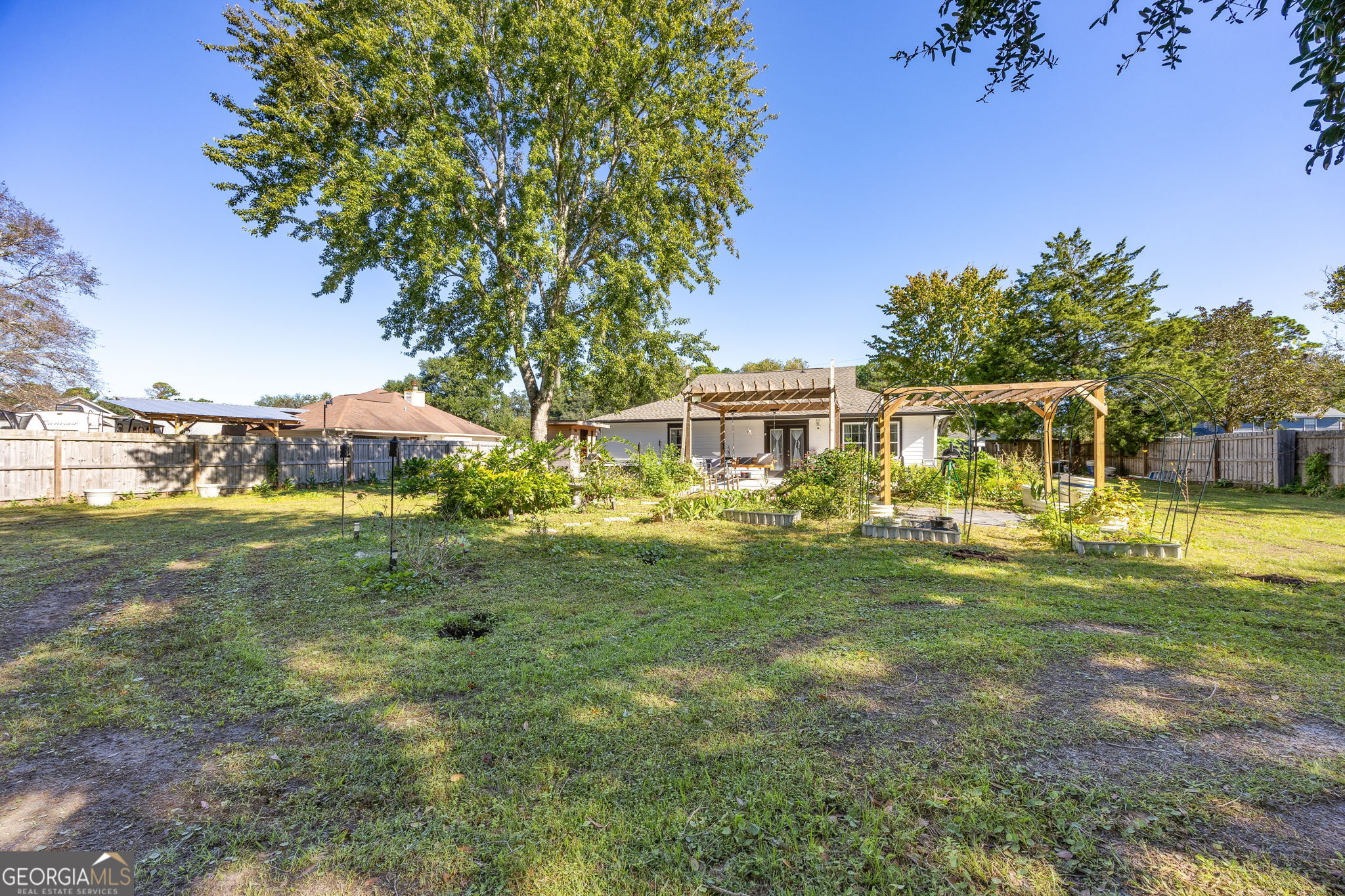 203 Foxwood Circle St. Marys, GA 31558 - Photo 33 of 52 a front view of a house with a garden