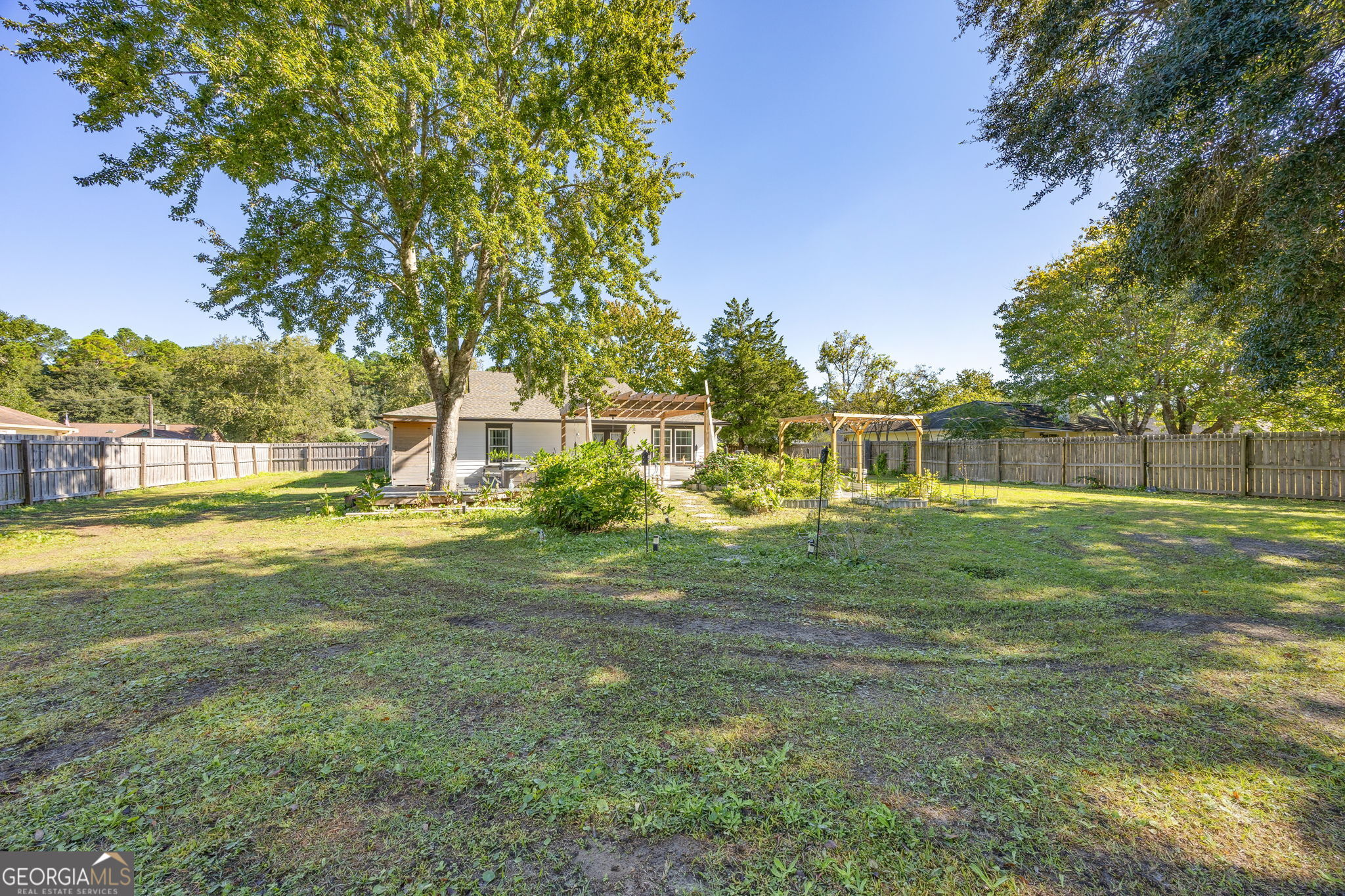 203 Foxwood Circle St. Marys, GA 31558 - Photo 34 of 52 a view of a house with a big yard