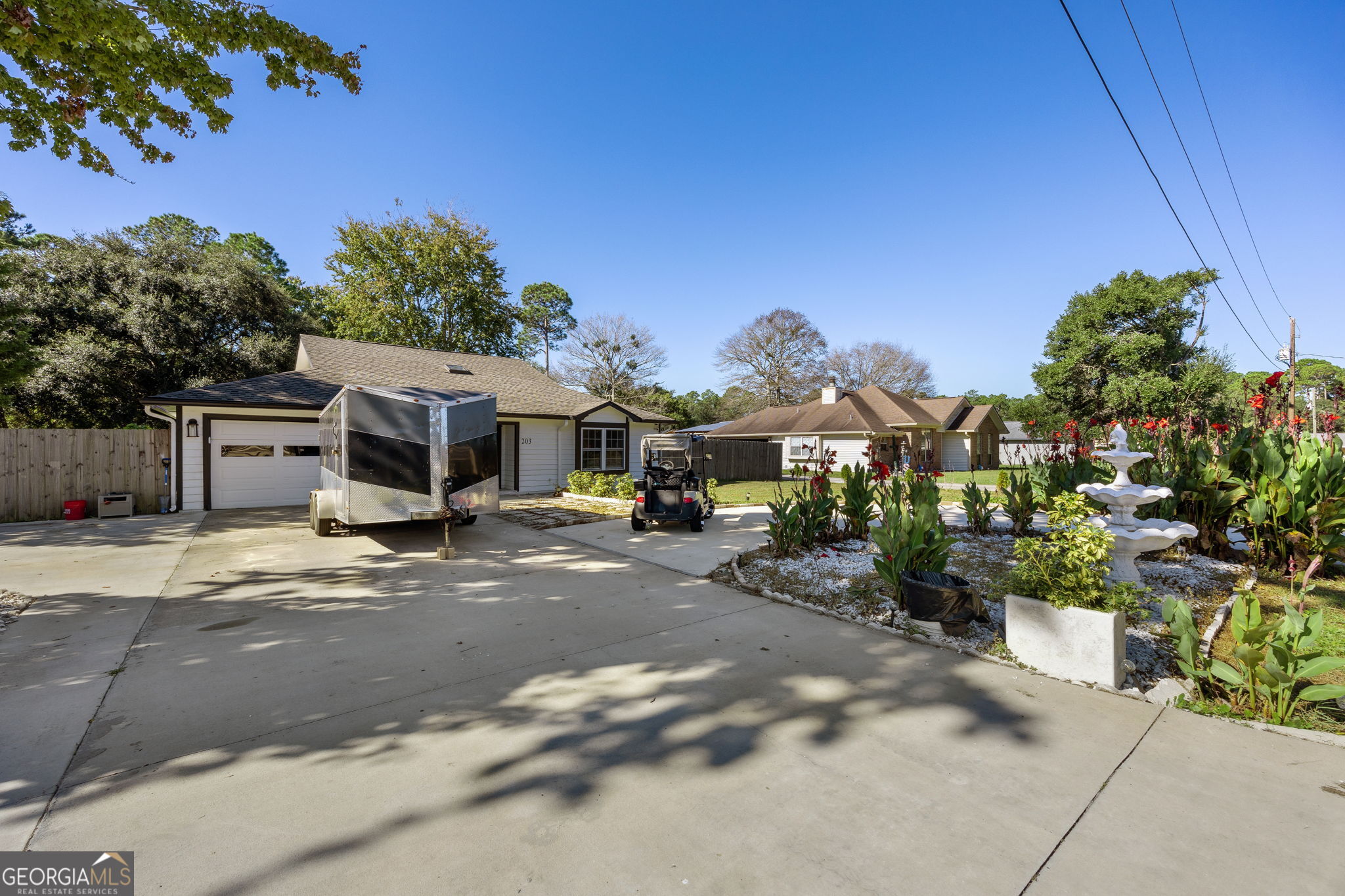 203 Foxwood Circle St. Marys, GA 31558 - Photo 4 of 52 a front view of a house with a yard and a garage