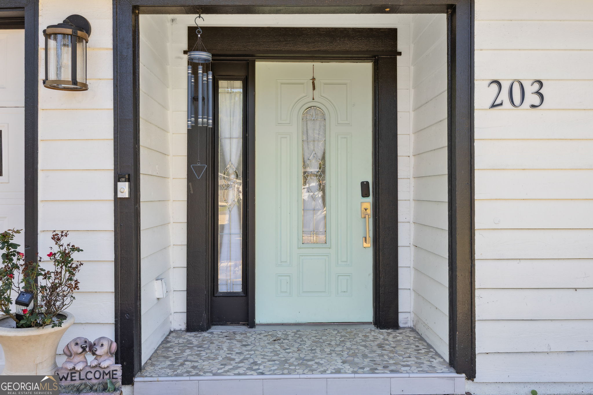 203 Foxwood Circle St. Marys, GA 31558 - Photo 6 of 52 a view of a hallway with wooden floor and a dining room