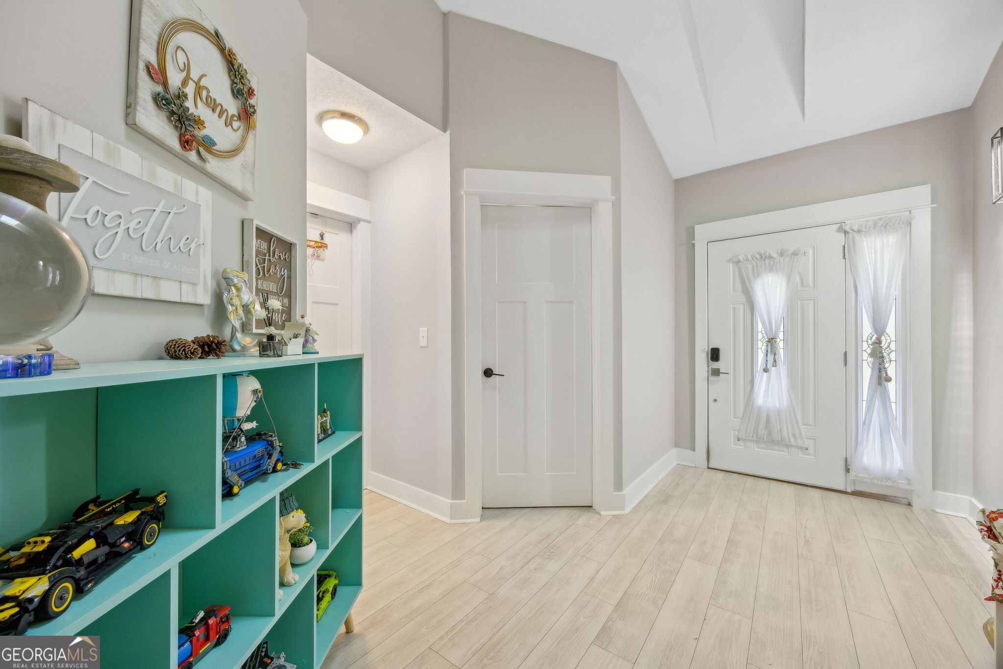 203 Foxwood Circle St. Marys, GA 31558 - Photo 7 of 52 a view of an entryway with paintings on the wall