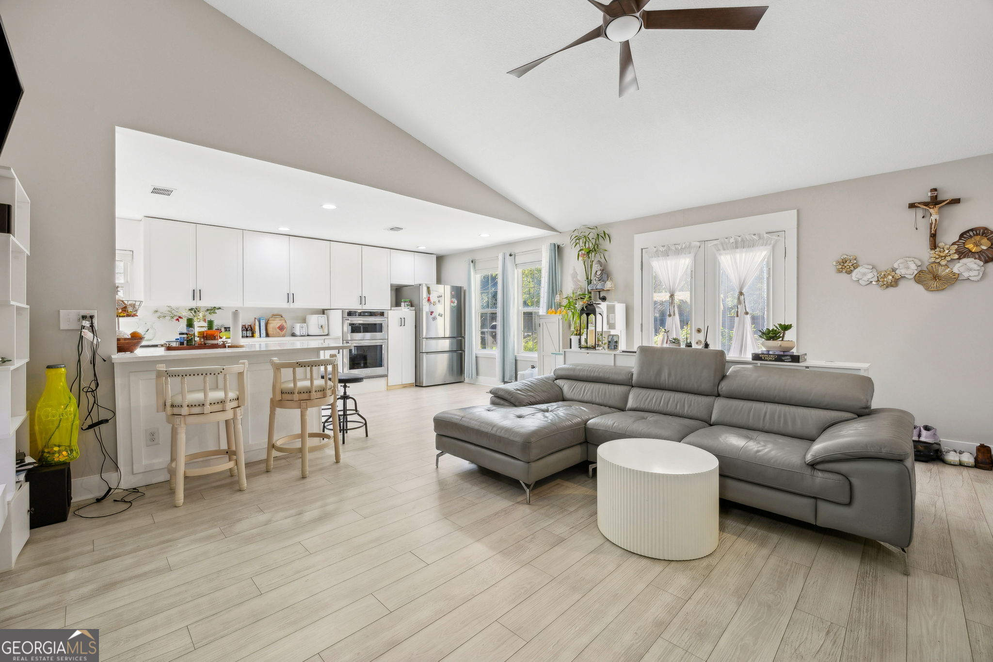 203 Foxwood Circle St. Marys, GA 31558 - Photo 8 of 52 a living room with furniture kitchen view and a wooden floor