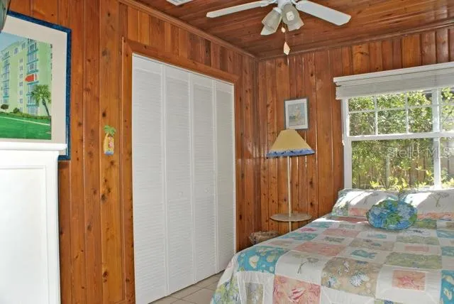 a living room with furniture a window and a chandelier