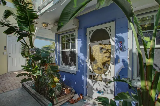 a vase of flowers sitting on a floor