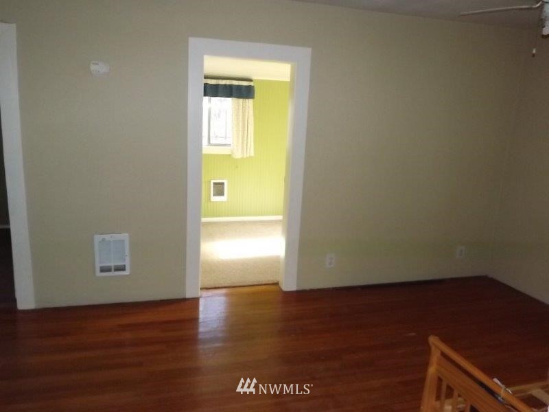 111 Frank Road Omak, WA 98841 - Photo 14 of 25 a view of an empty room and wooden floor