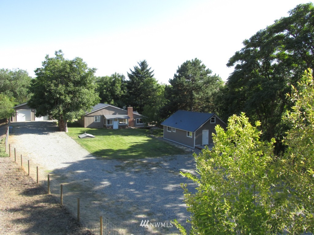 111 Frank Road Omak, WA 98841 - Photo 4 of 25 a view of yard with swimming pool and trees in the background