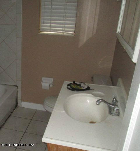 6125 Stetson Road Jacksonville, FL 32217 - Photo 4 of 7 a bathroom with a sink and a toilet