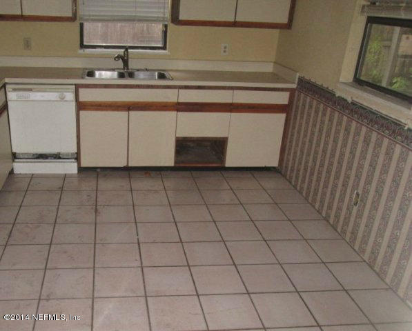 6125 Stetson Road Jacksonville, FL 32217 - Photo 5 of 7 a kitchen with a sink and cabinets
