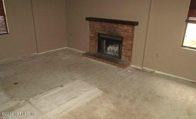 6125 Stetson Road Jacksonville, FL 32217 - Photo 6 of 7 a view of empty room with a fireplace