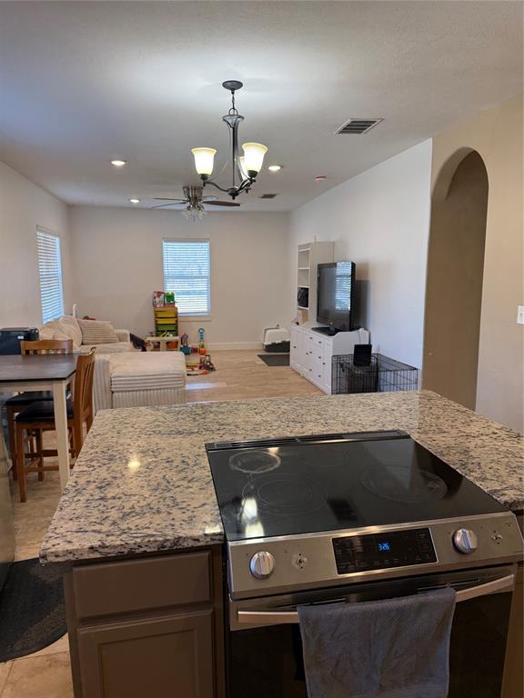 809 South Wine Street Gainesville, TX 76240 - Photo 33 of 33 a view of a kitchen with stainless steel appliances granite countertop a stove and a sink