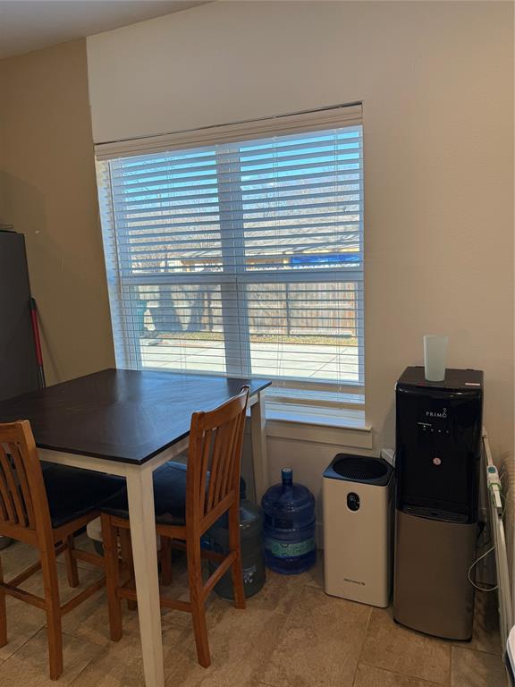 809 South Wine Street Gainesville, TX 76240 - Photo 12 of 33 a room with furniture and a window