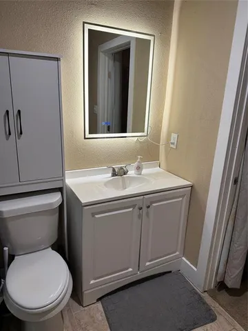 a bedroom with a bed and a closet