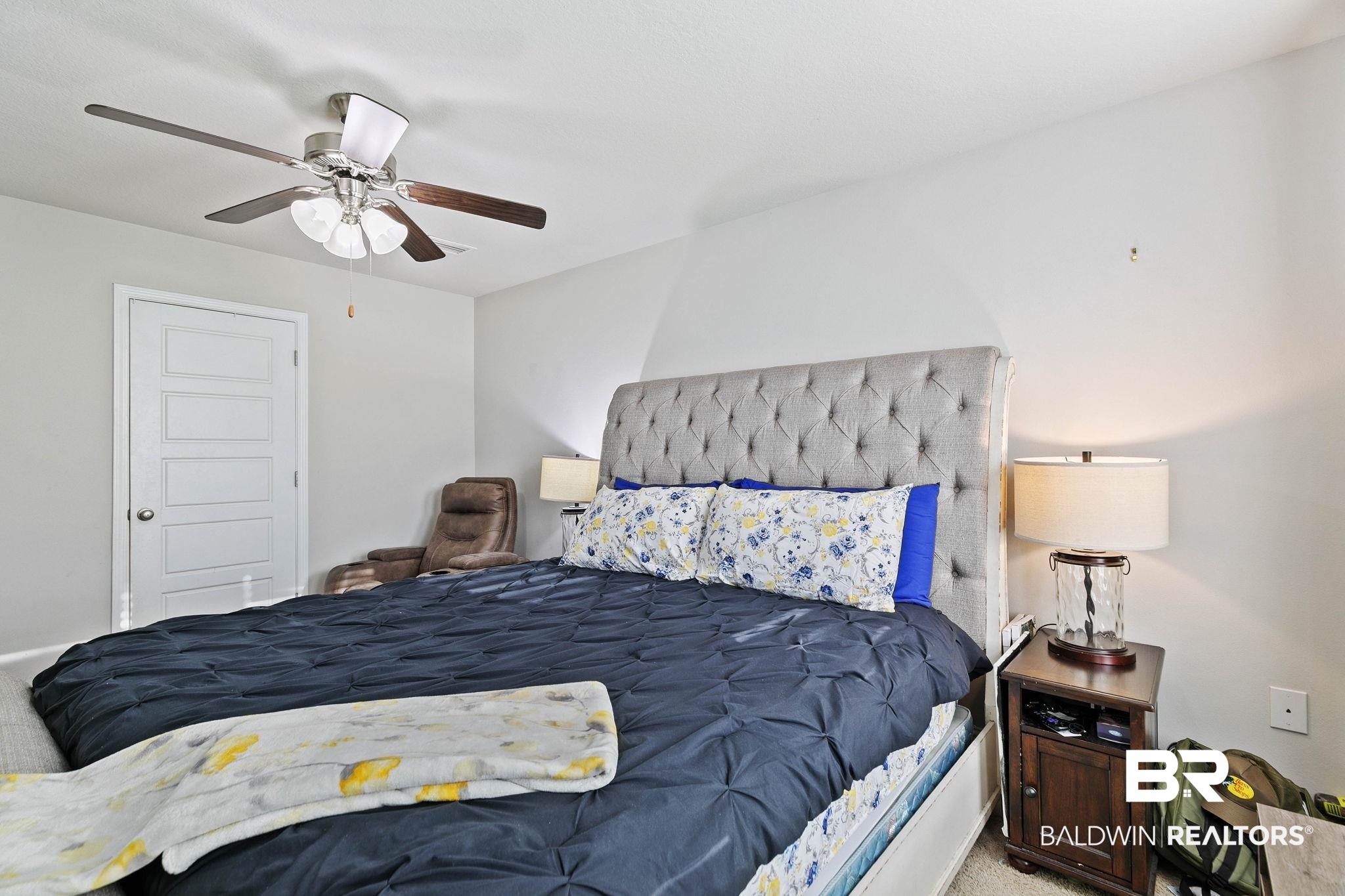 25806 Pollard Road, Unit 24 Daphne, AL 36526 - Photo 18 of 33 Carpeted bedroom featuring ceiling fan and a closet