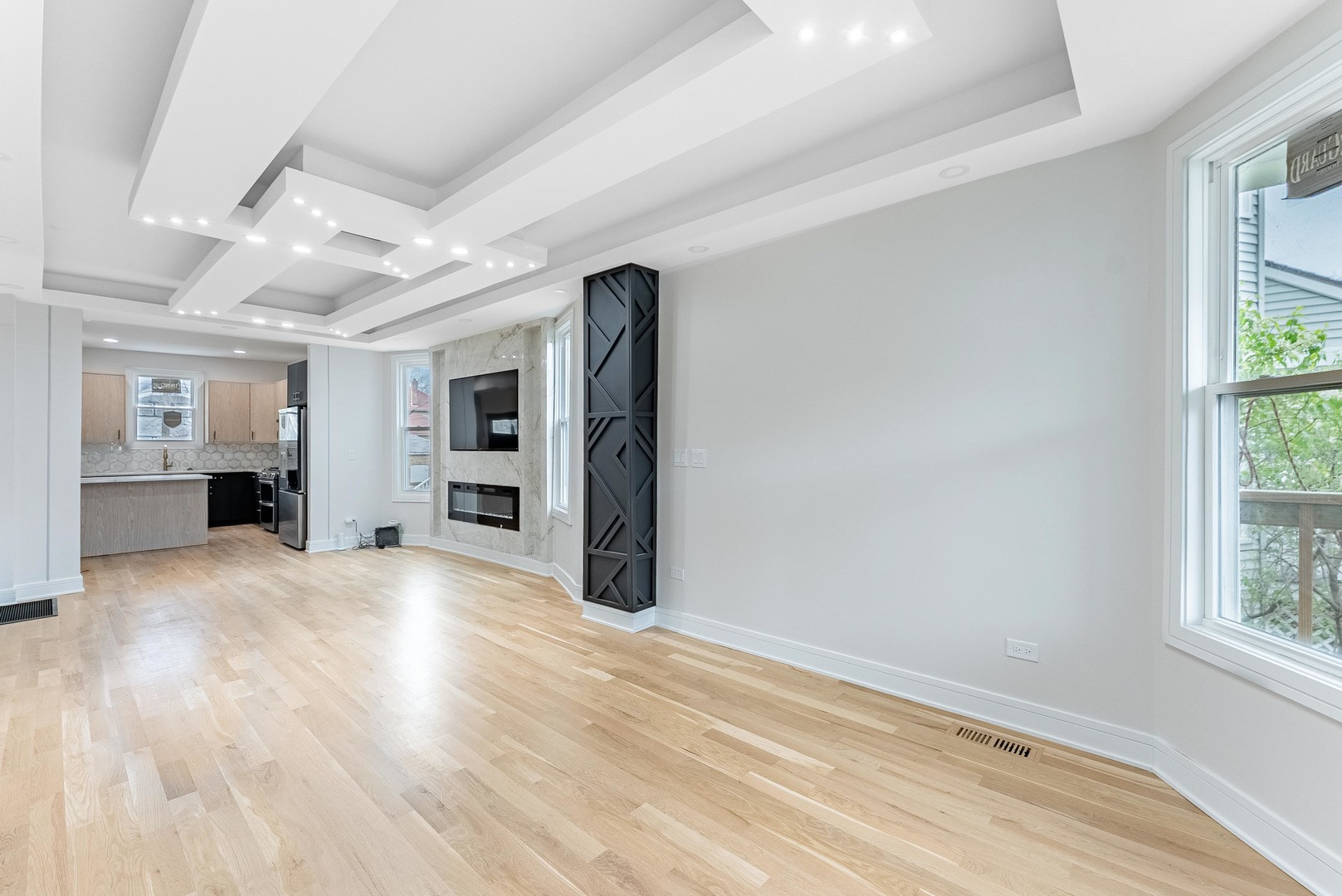 822 North Lockwood Avenue Chicago, IL 60651 - Photo 12 of 63 a view of a hallway with wooden floor and windows