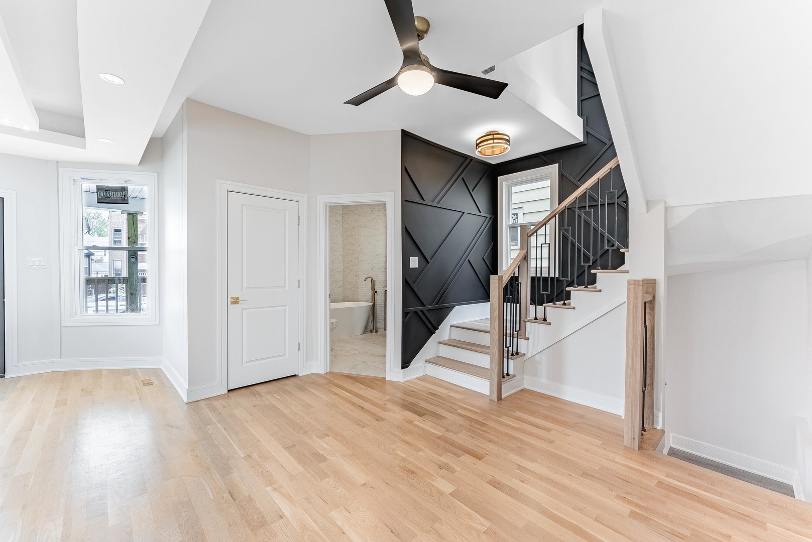 822 North Lockwood Avenue Chicago, IL 60651 - Photo 14 of 63 a view of a hallway with wooden floor and staircase