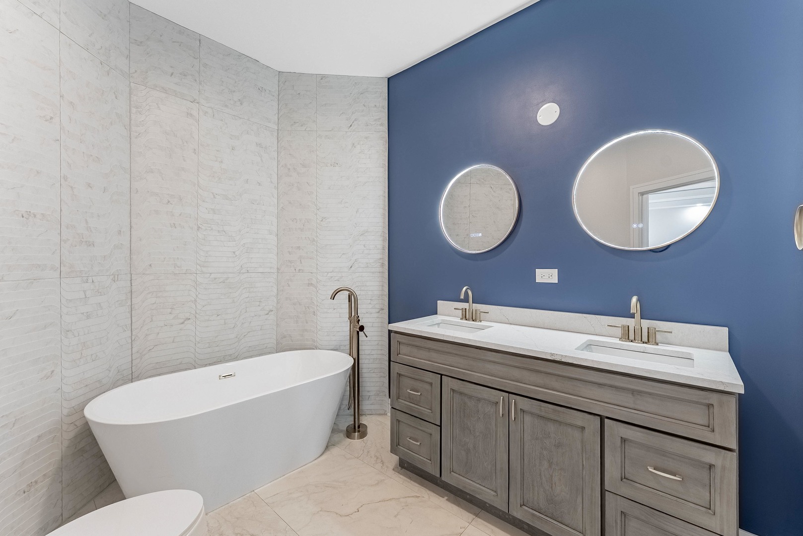 822 North Lockwood Avenue Chicago, IL 60651 - Photo 16 of 63 a bathroom with a double vanity sink mirror and toilet